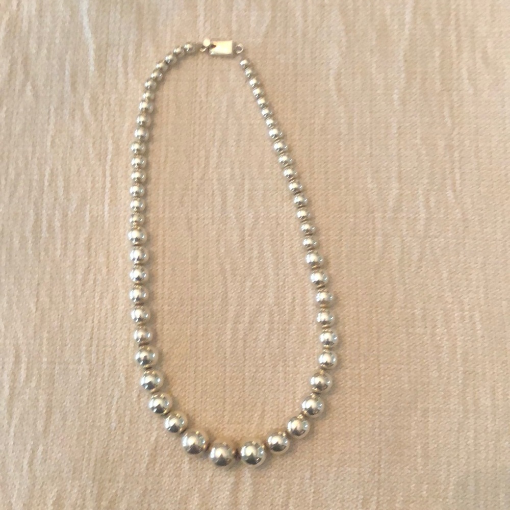 Sliver beaded necklace approximately 20 inches long